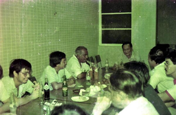 1974 Singapore Telecom Staff meeting - chatting with Woon Khai Boon